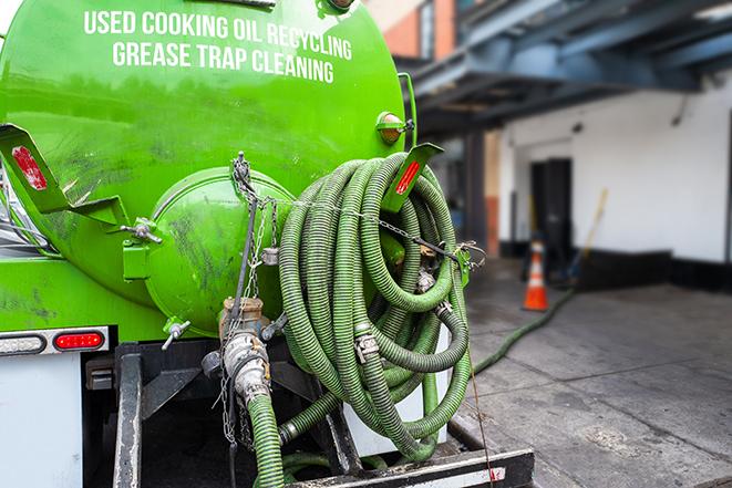 grease trap pumping truck servicing a restaurant in Beloit